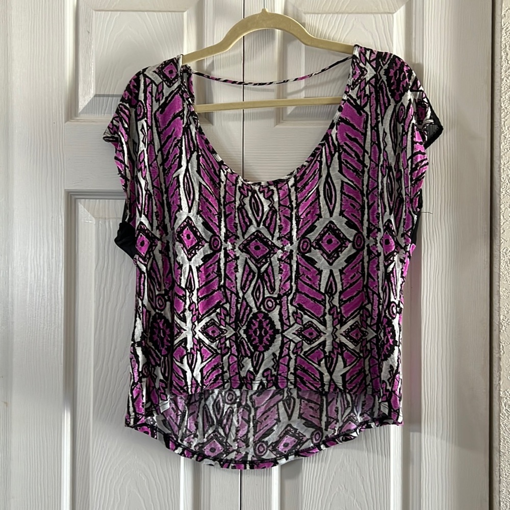 High low design and mesh. Fun tribal pattern with a popping hot pink color